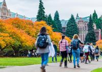 UW Quad in autumn with students walking across the quad.