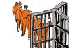 inmates lining up behind bars