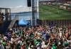 a crowd watches a World Cup match on a large screen at the Seattle Waterfront