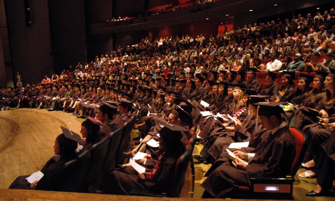 seated graduates in Meany Hall